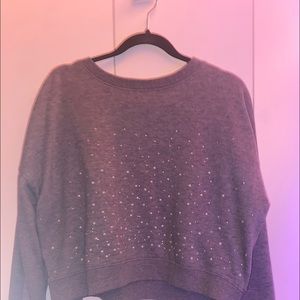 Long sleeve gray sweater.